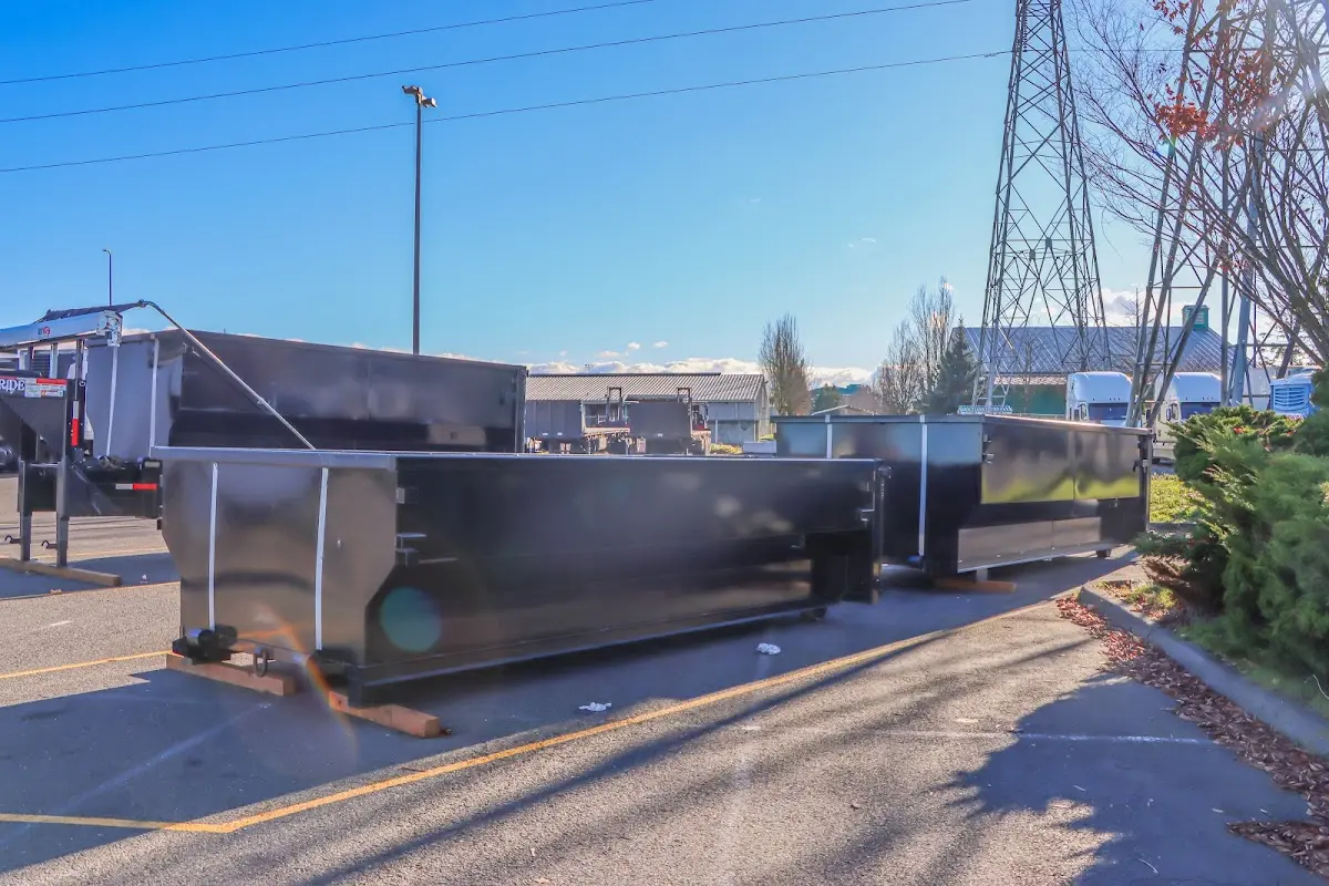 Roll-off dumpster ready for waste disposal at job site for 2 Yard Dumpster Rental in Clayton